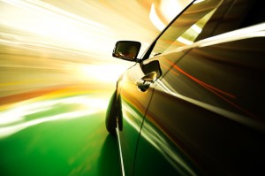 A speeding car with blurred lights