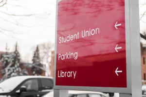 campus sign giving directions to various places