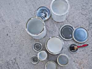 Paint cans and paintbrush