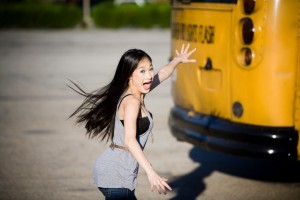 Asian girl running late for bus